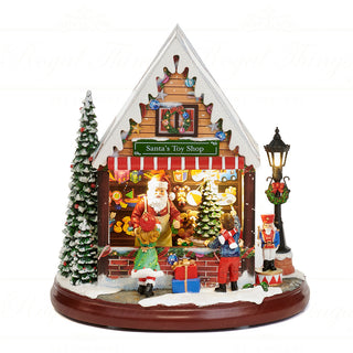 Scena Natalizia Santa Toy Shop con LED, Musica e Movimento Goodwill 27 cm.